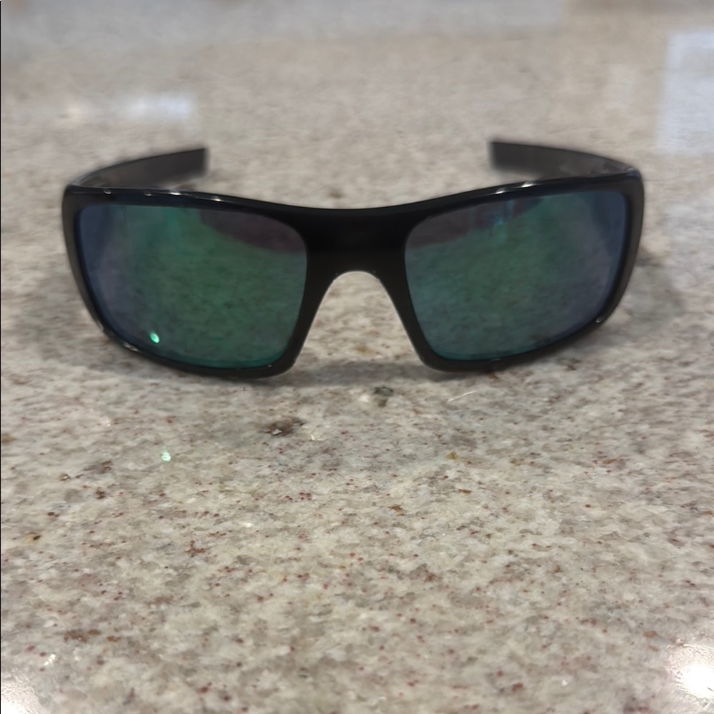 Black Oakley Sunglasses with Green Lenses